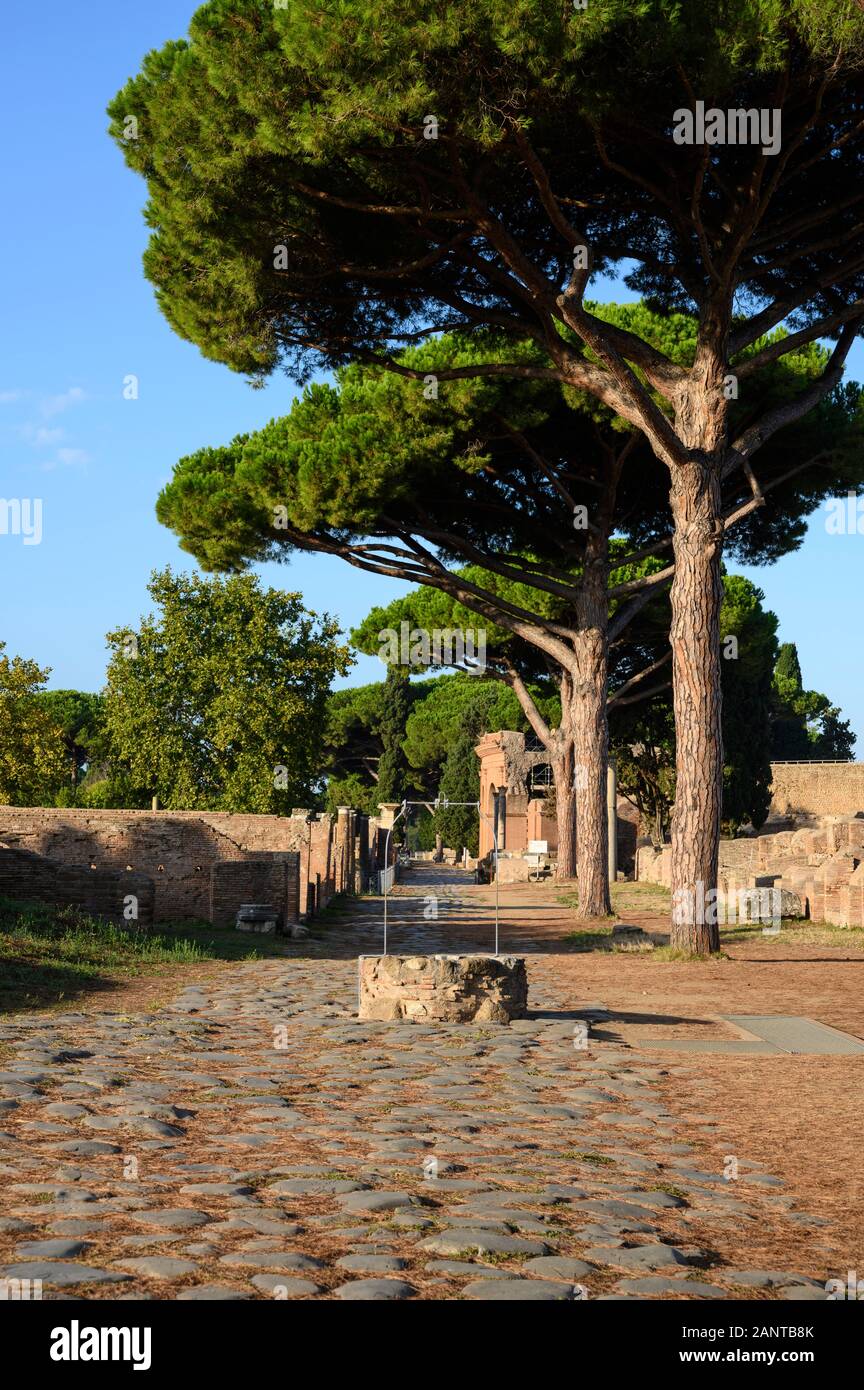 Rome. Italy. Ostia Antica. Decumanus Maximus, the principle Roman road in the east half of Ostia. It runs from east to west, starting at the Porta Rom Stock Photo