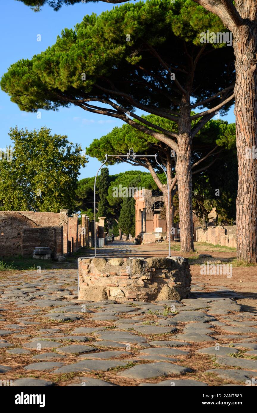 Rome. Italy. Ostia Antica. Decumanus Maximus, the principle Roman road in the east half of Ostia. It runs from east to west, starting at the Porta Rom Stock Photo