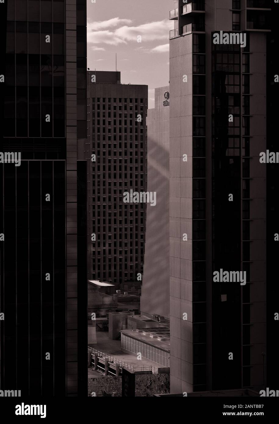 Monochrome cityscape of hi-rise building facades as symbols of dynamic business growth in modern city Stock Photo