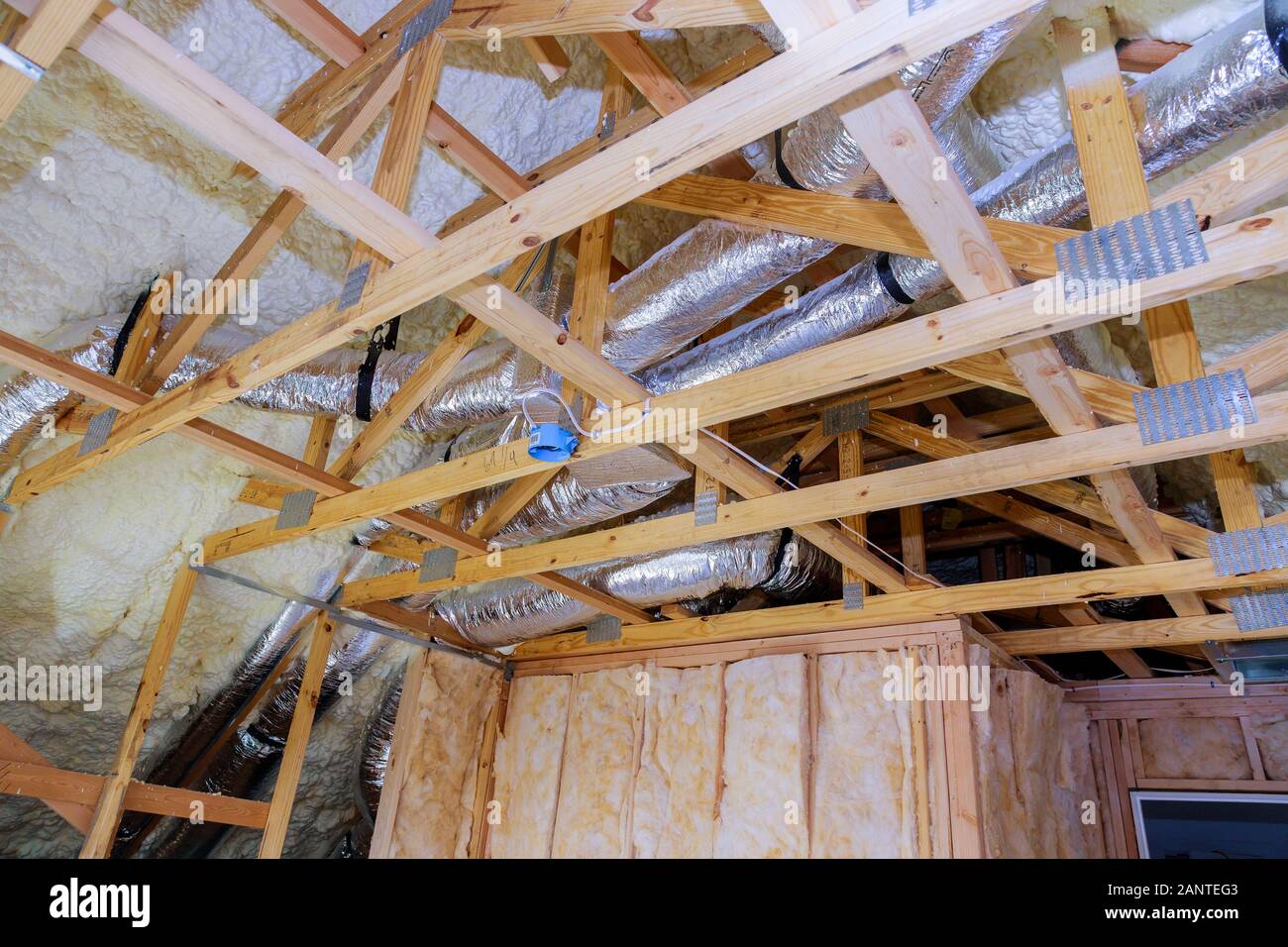 Air conditioning system attached to attic ceiling, foam plastic