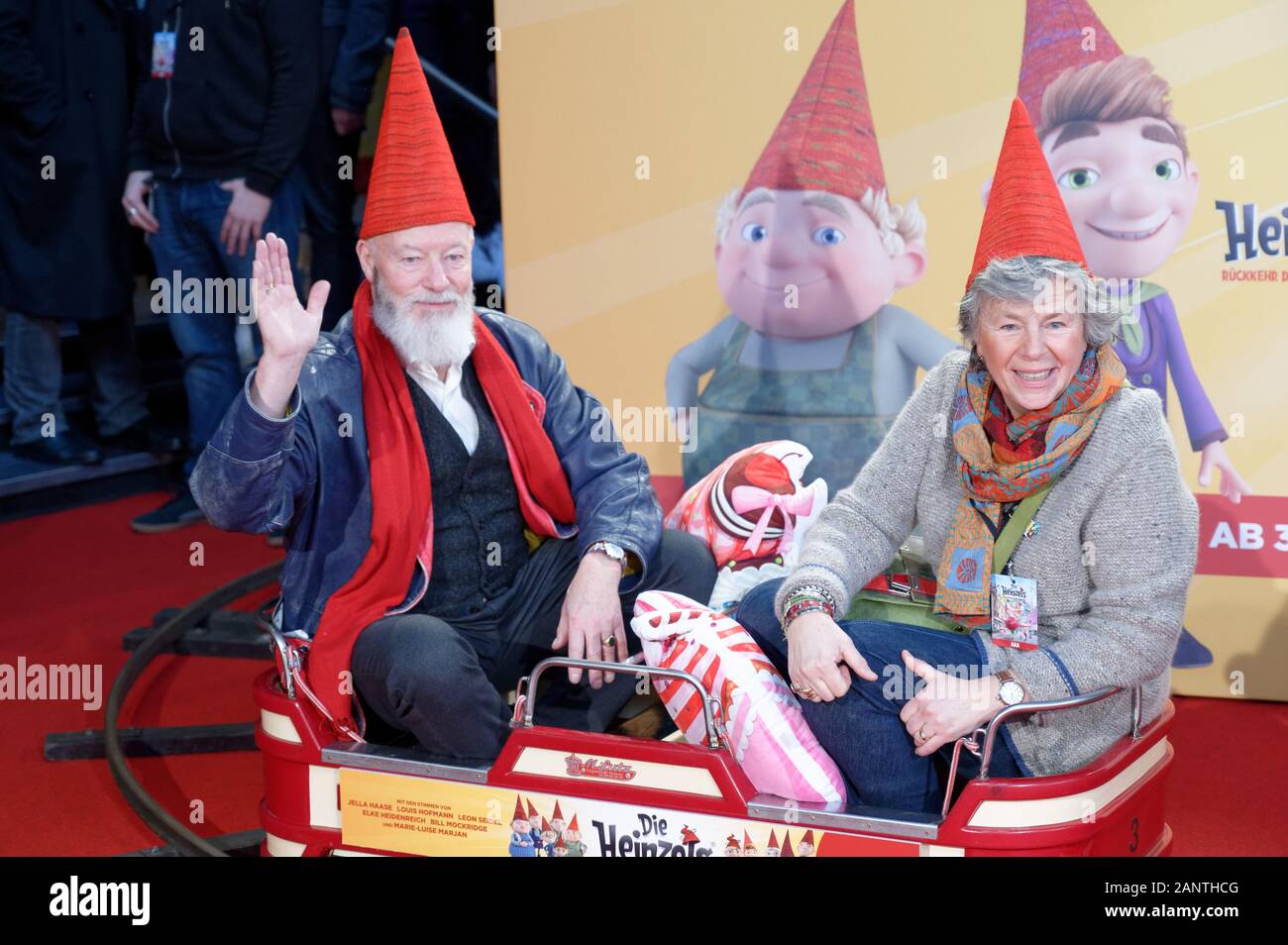 Cologne, Germany. 19th Jan, 2020. The actors Bill Mockridge (l) and Margie Kinsky (r) sit in a children's train before the premiere of the film 'The Heinzels - Return of the Brown Men'. The animated film will start in the cinemas on 30.01.2020. Credit: Henning Kaiser/dpa/Alamy Live News Stock Photo