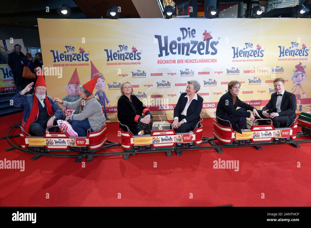 Cologne, Germany. 19th Jan, 2020. The actors Bill Mockridge Margie Kinsky, Elke Heidenreich, Marie-Luise Marjan, Louis Hofmann and Leon Seidel (l-r) sit in a children's train before the premiere of the film 'The Heinzels - Return of the Brown Men'. The animated film will start in the cinemas on 30.01.2020. Credit: Henning Kaiser/dpa/Alamy Live News Stock Photo