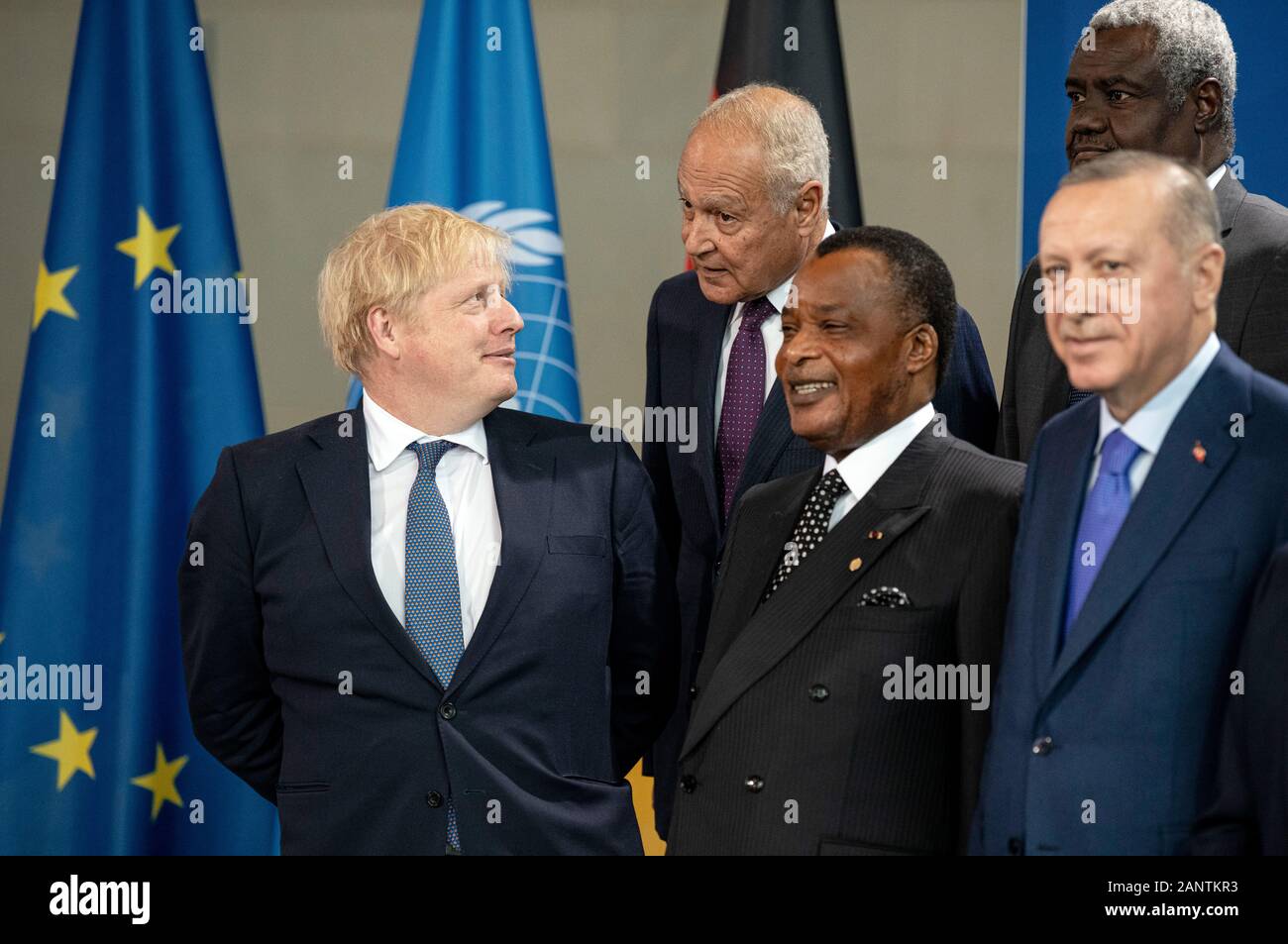 Berlin, Germany. 19th Jan, 2020. At the family photo, (front, l-r) Boris Johnson, Prime Minister of Great Britain, Denis Sassou Nguesso, President of the Congo, Recep Tayyip Erdogan, President of Turkey, (2nd row, l-r) Ahmed Aboulgheit Secretary General of the Arab League, Moussa Faki, Chairman of the African Union, meet in the Federal Chancellery at the beginning of the Libya Conference at the family photo. The aim of the conference is a lasting ceasefire in the civil war country. Credit: Fabian Sommer/dpa/Alamy Live News Stock Photo
