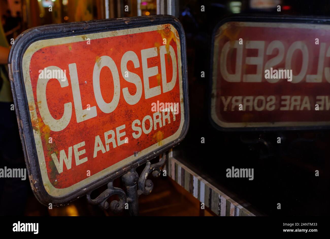 sign on closed shop with the words Sorry We're closed Stock Photo
