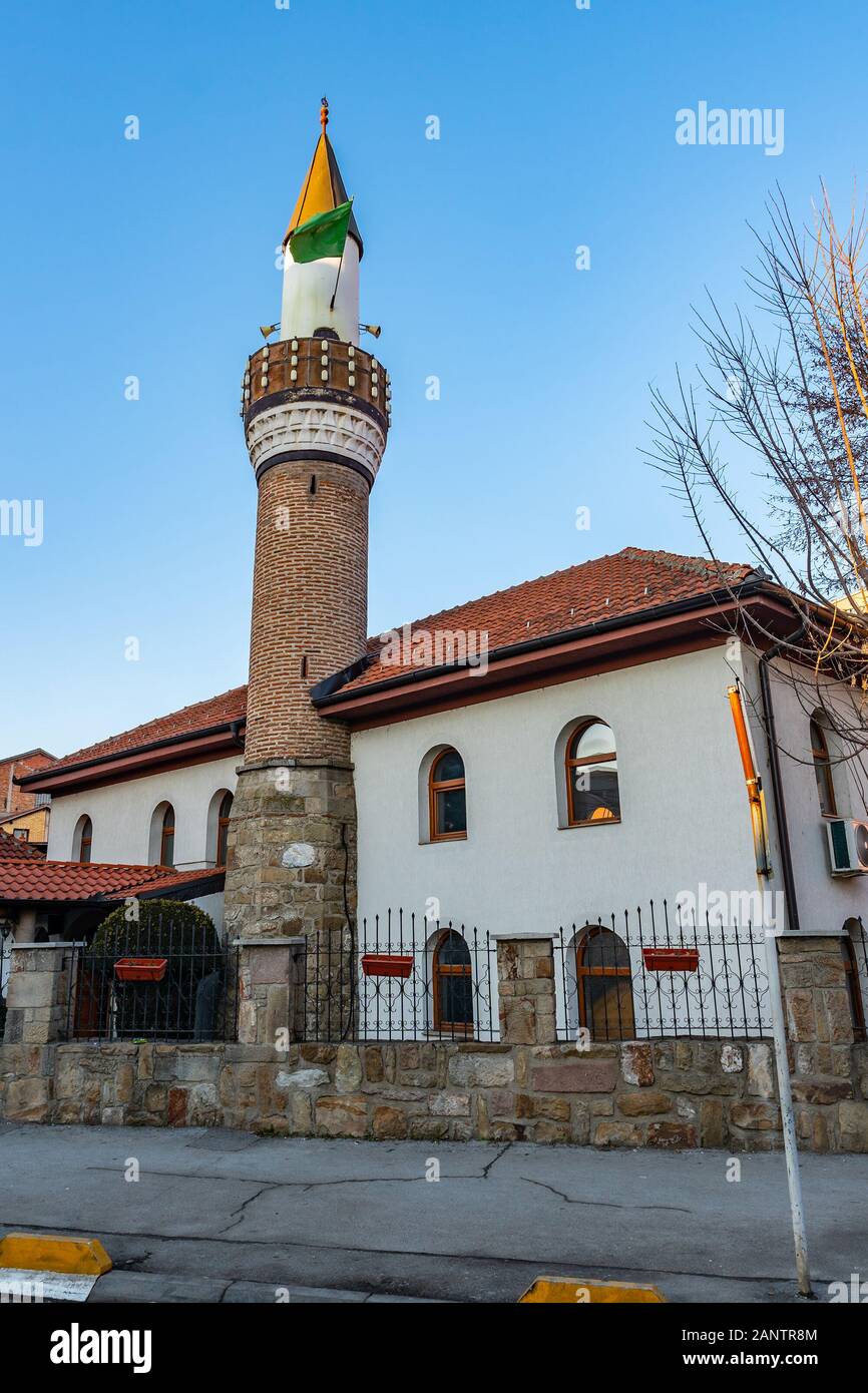 Novi Pazar Melajska Dzamija Mosque Picturesque View with Waving Green Colored Islamic Flag on a Sunny Blue Sky Day Stock Photo