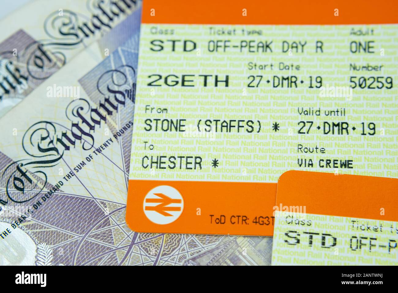 National rail train tickets placed on top 20 pound banknotes. Stock Photo