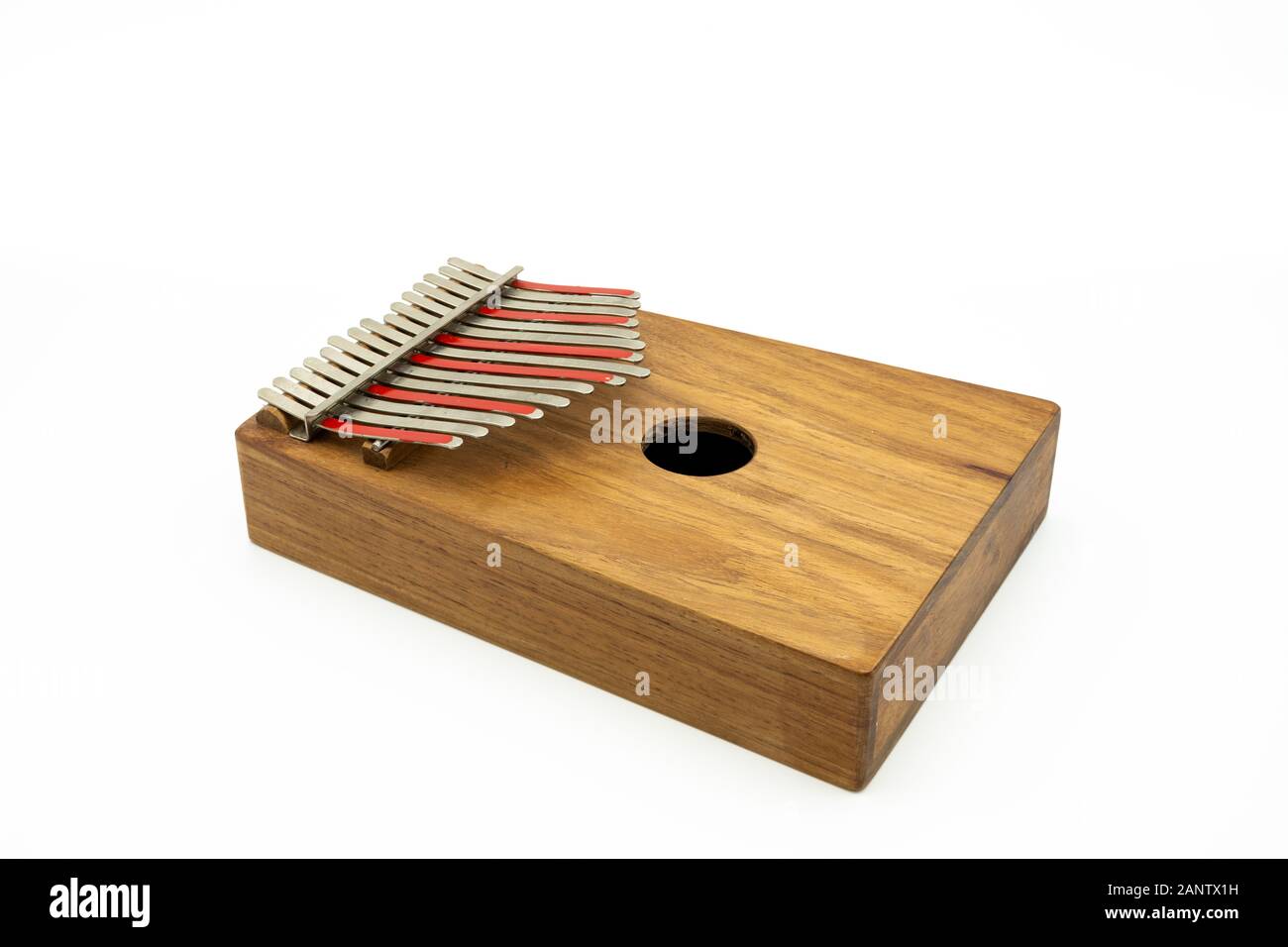 Details of a thumb piano (Kalimba, Mbira) with silver and red tines ...