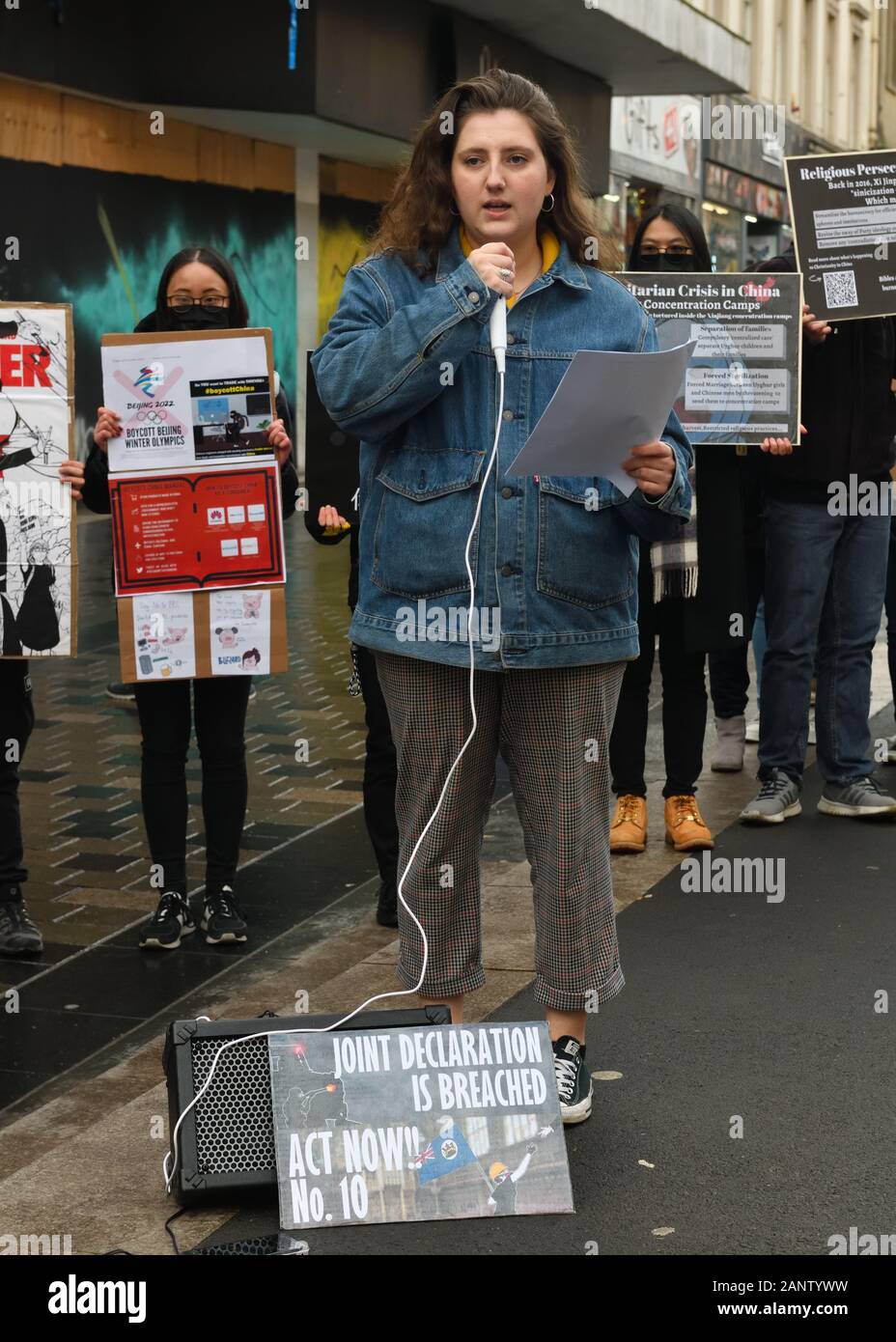 19th, January, 2020,  Glasgow, Scotland, UK. Students for 'Democracy for Hong Kong in Scotland'  protest in Glasgow city centre against the Chinese government's treatment of Hong Kong residents by depicting scenes of the unrest and HK police. A speaker from Amnesty International was also speaking at the event Stock Photo