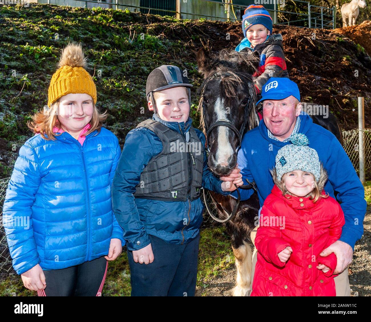 Dunmanway, West Cork, Ireland. 19th Jan, 2020. West Cork Chevals hosted a cheval today in aid of Dunmanway and District Community Council. The cheval consisted of 31 horses and rode from Ballabuidhe race field to Ballinacarriga GAA ground and back. At the cheval were Mary Hurley, Owen Wiliamson, James Hurley, Junior Williamson and Theresa Hurley with their pony 'Jessie', all from Leap. Credit: Andy Gibson/Alamy Live News Stock Photo