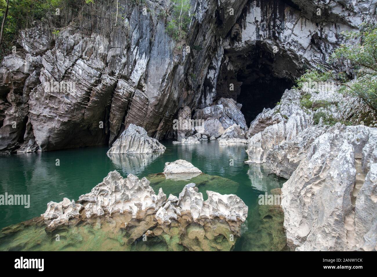 Jagged limestone rock at entrance to Xe Bang Fai River Cave, Laos Stock Photo