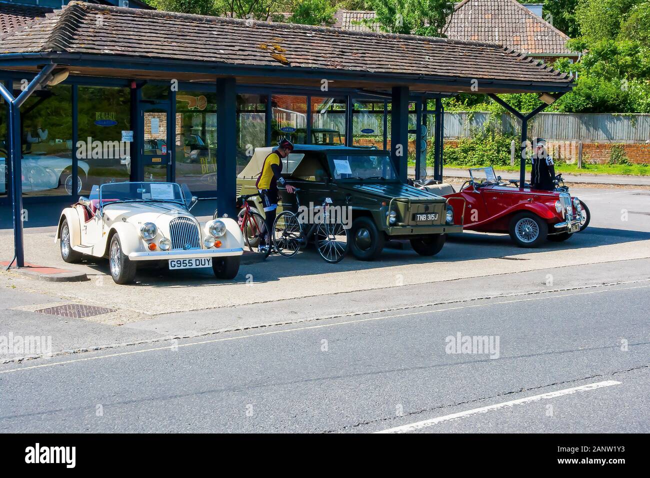 10 June 2015 The forecourt of New Forest Classic Cars Ltd business with classic vintage cars for sale and on display in Beaulieu Village in Hampshire Stock Photo