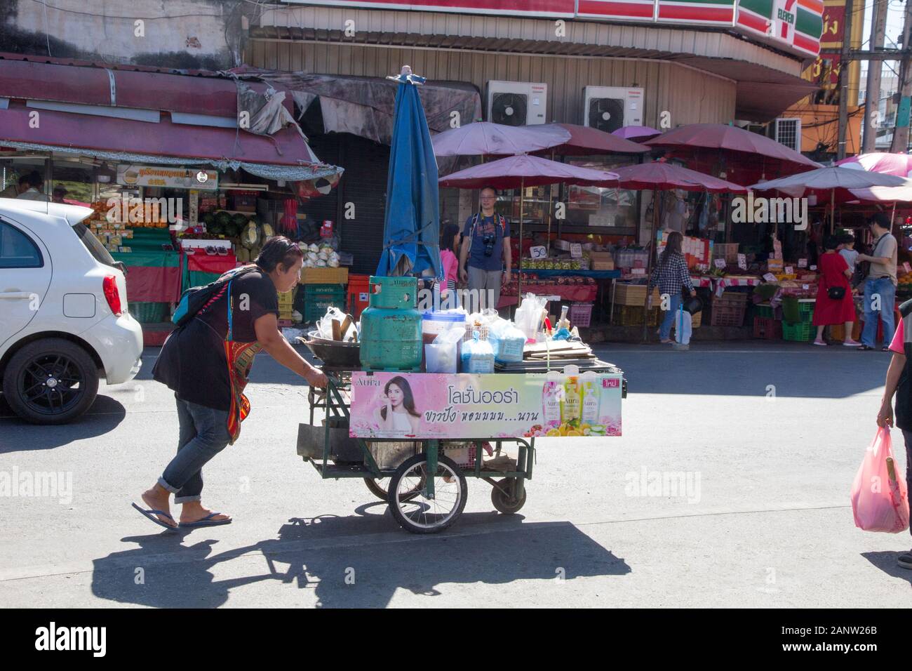 Chiang Mai woman seller pushing cart in street Thailand Chiang Mai ...