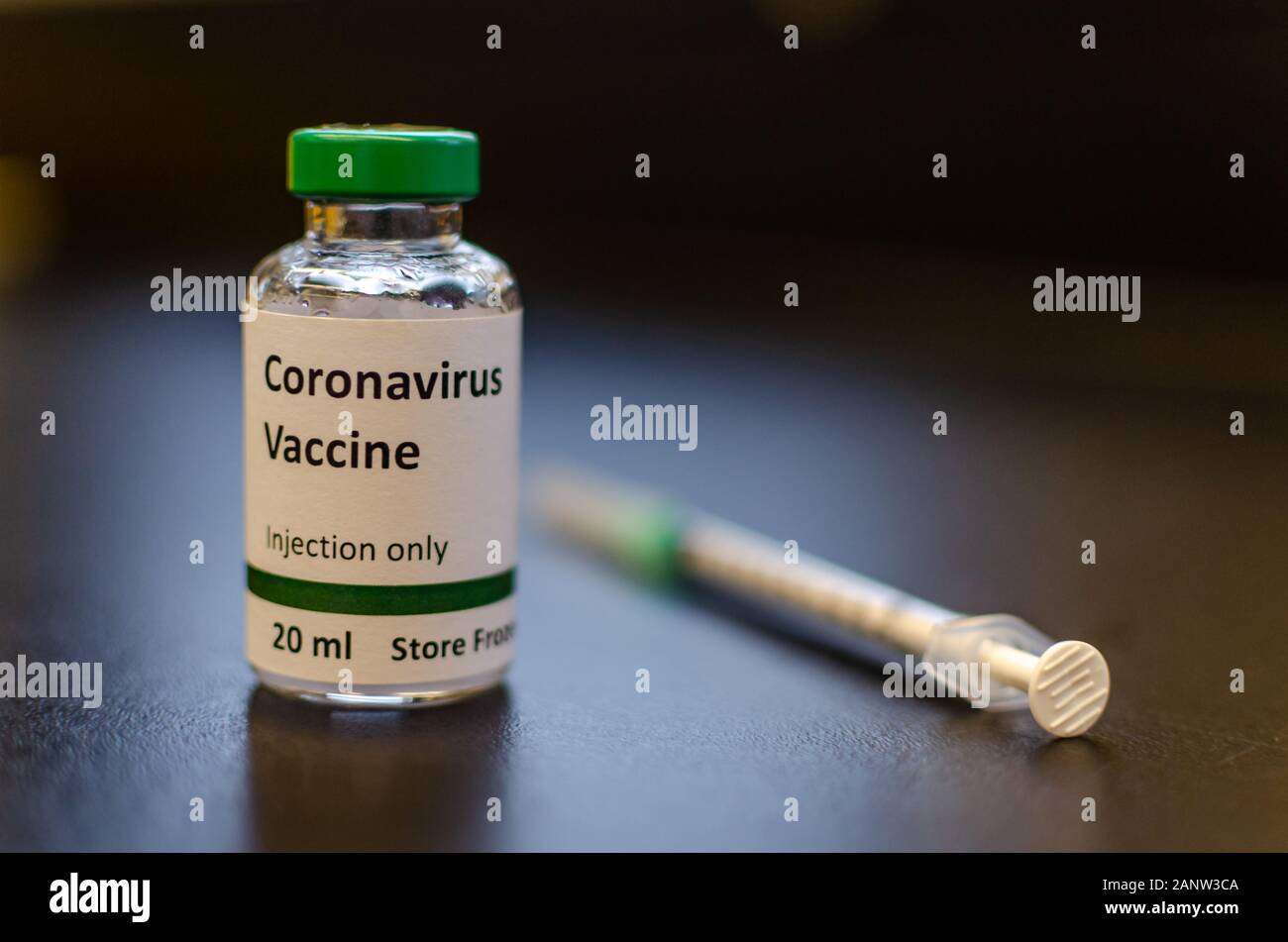 Coronavirus vaccine vial with injection syringe Stock Photo