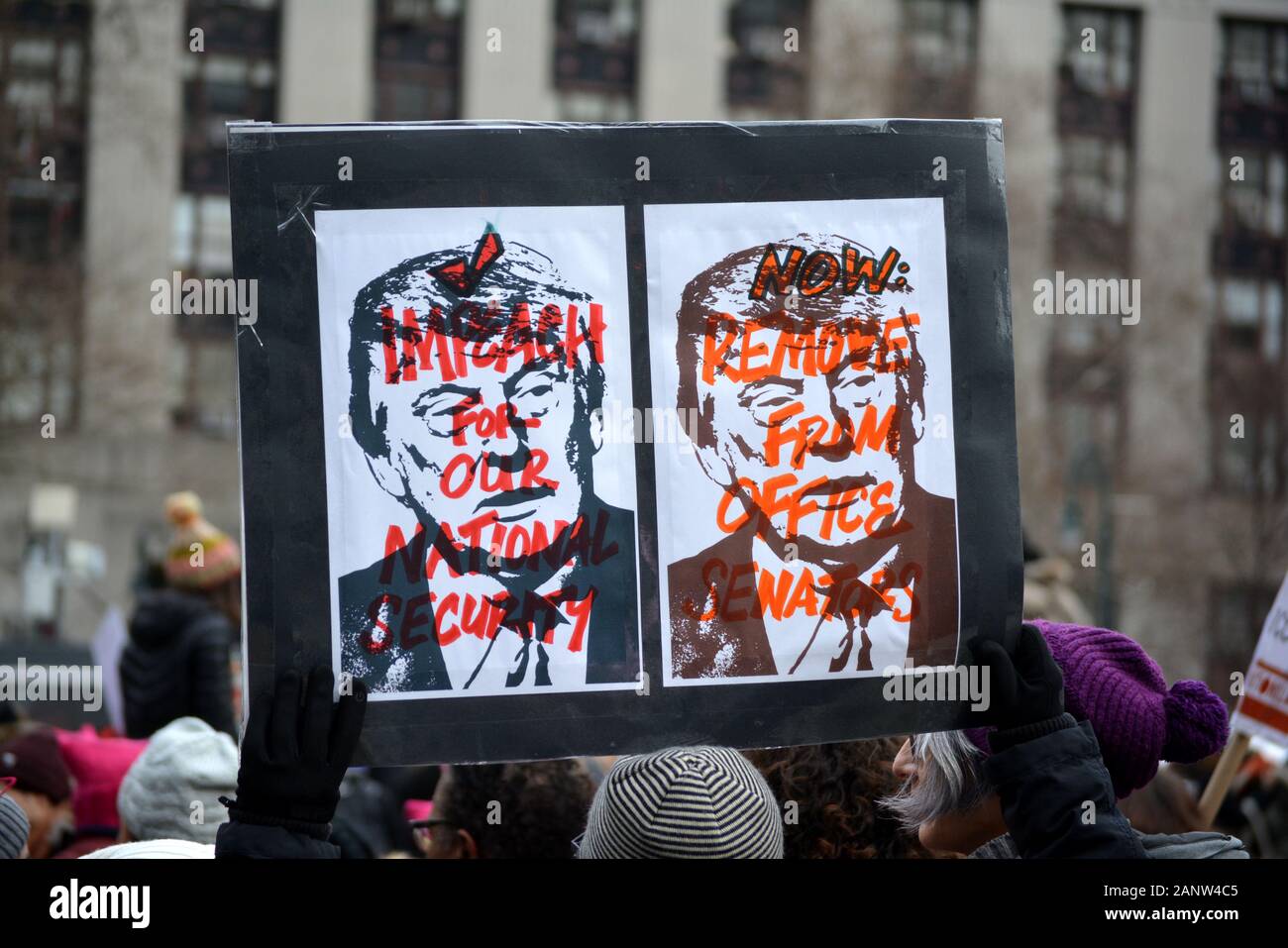 People holding signs at the 'Rise and Roar' Women's March from Lower Manhattan to Time's Square. Stock Photo