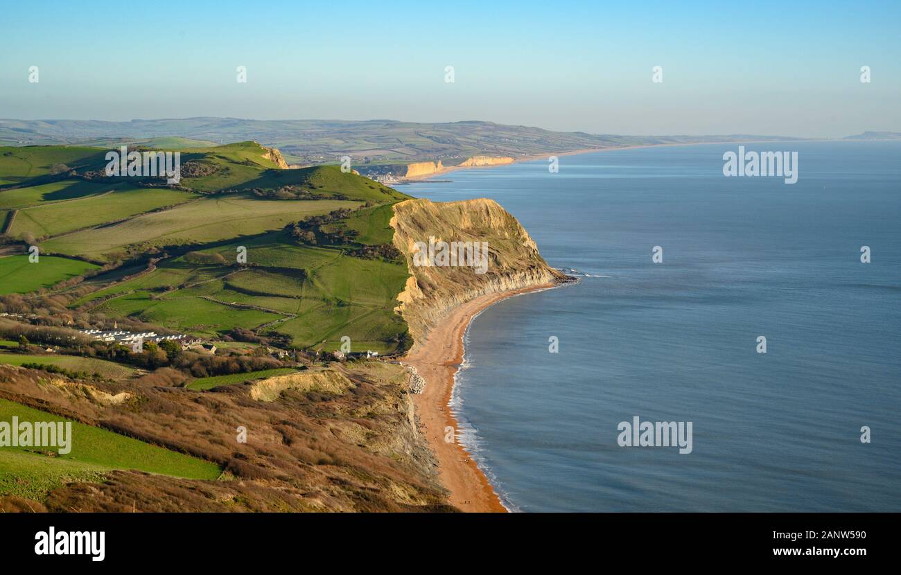 Jurassic Coast, Dorset, UK. 19th January 2020: An afternoon of glorious sunshine and crisp blue skies on the Jurassic Coast. After weeks of heavy rain and high winds, the stunning West Dorset coastline is bathed in winter sunshine on a bright and chilly winters day.  View of the Jurassic coast from Golden Cap looking out over West Bay and Portland. Golden Cap. Credit: Celia McMahon/Alamy Live News. Stock Photo