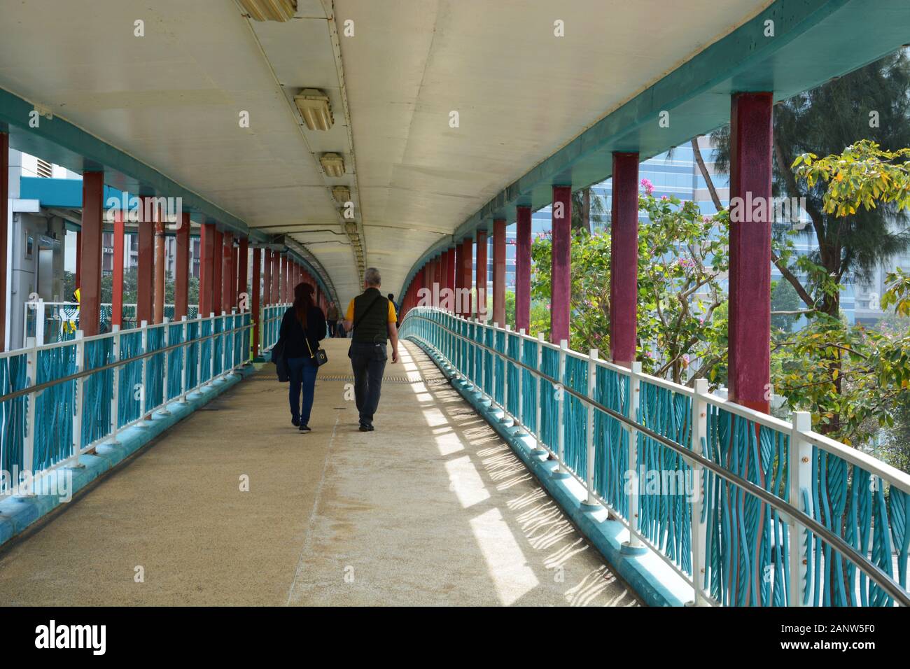 The pedestrian overpass at Quarry Bay Park along Victoria Harbour in Hong Kong. Stock Photo
