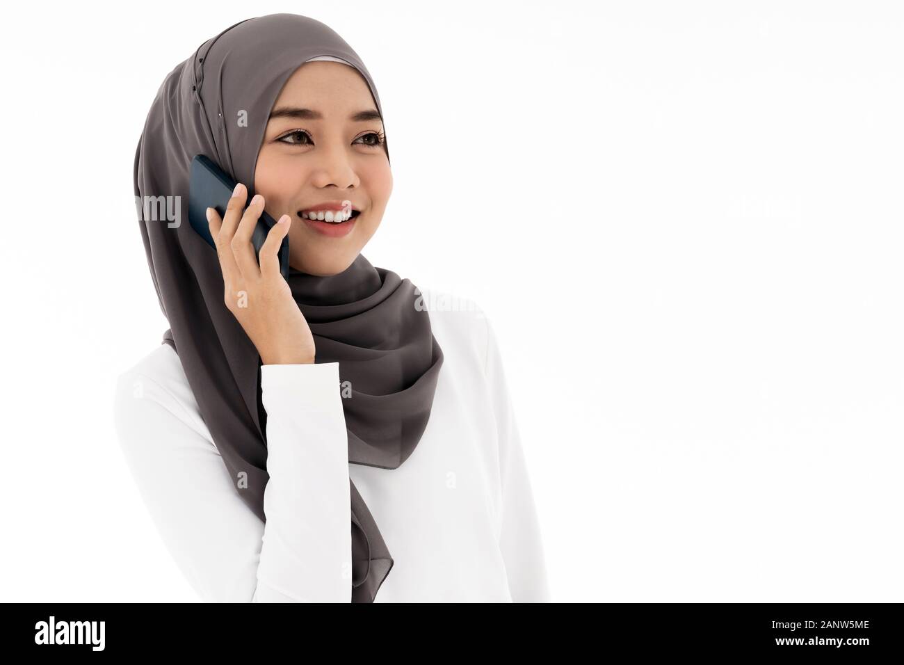 Portrait of attractive asian young adult muslim woman in a white hijab ...