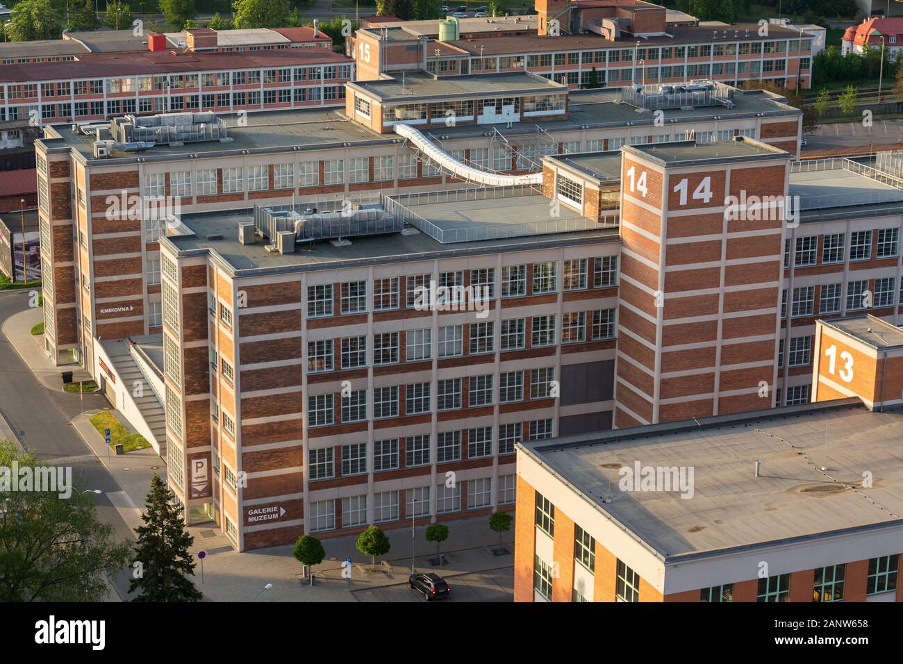 Traditional Zlin red brick buildings exterior, former shoe factory, Moravia, Czech Republic, sunny summer day, aerial view Stock Photo