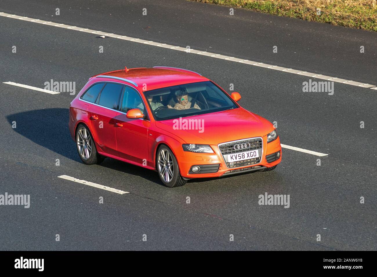 2008 red Audi A4 Avant S Line TDI Auto; Vehicular traffic, transport, modern, saloon cars, south-bound on the M61 Motorway, Manchester, UK Stock Photo
