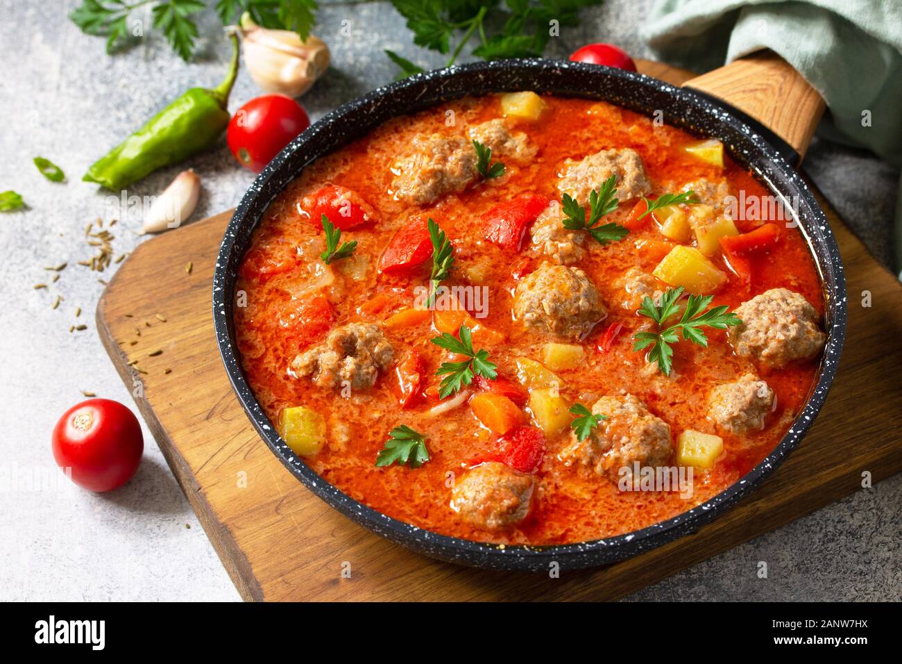 Spanish and Mexican food - Albondigas. Hot stew tomato soup with meatballs and vegetables. Stock Photo