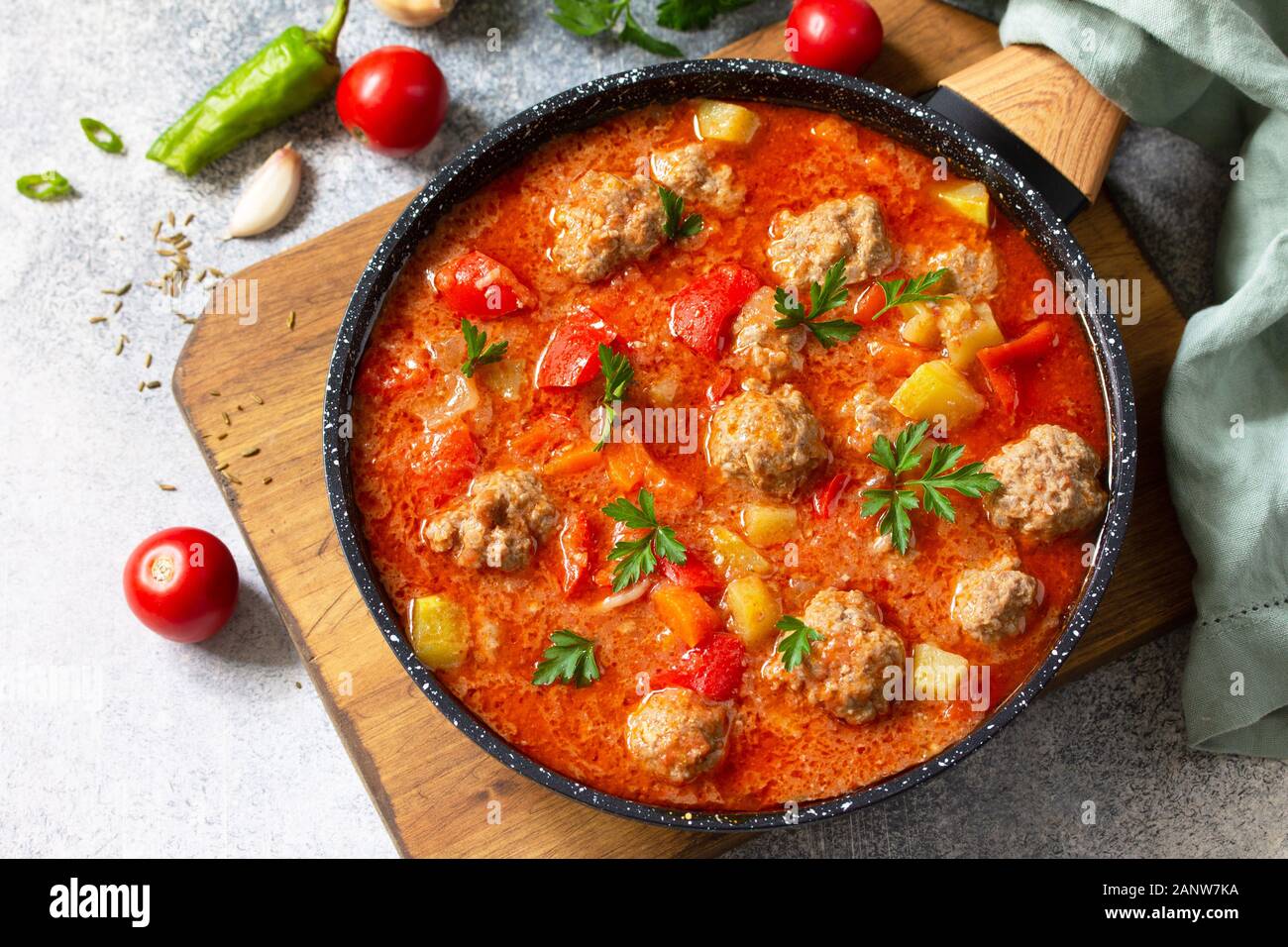 Spanish and Mexican food - Albondigas. Hot stew tomato soup with meatballs and vegetables. Stock Photo