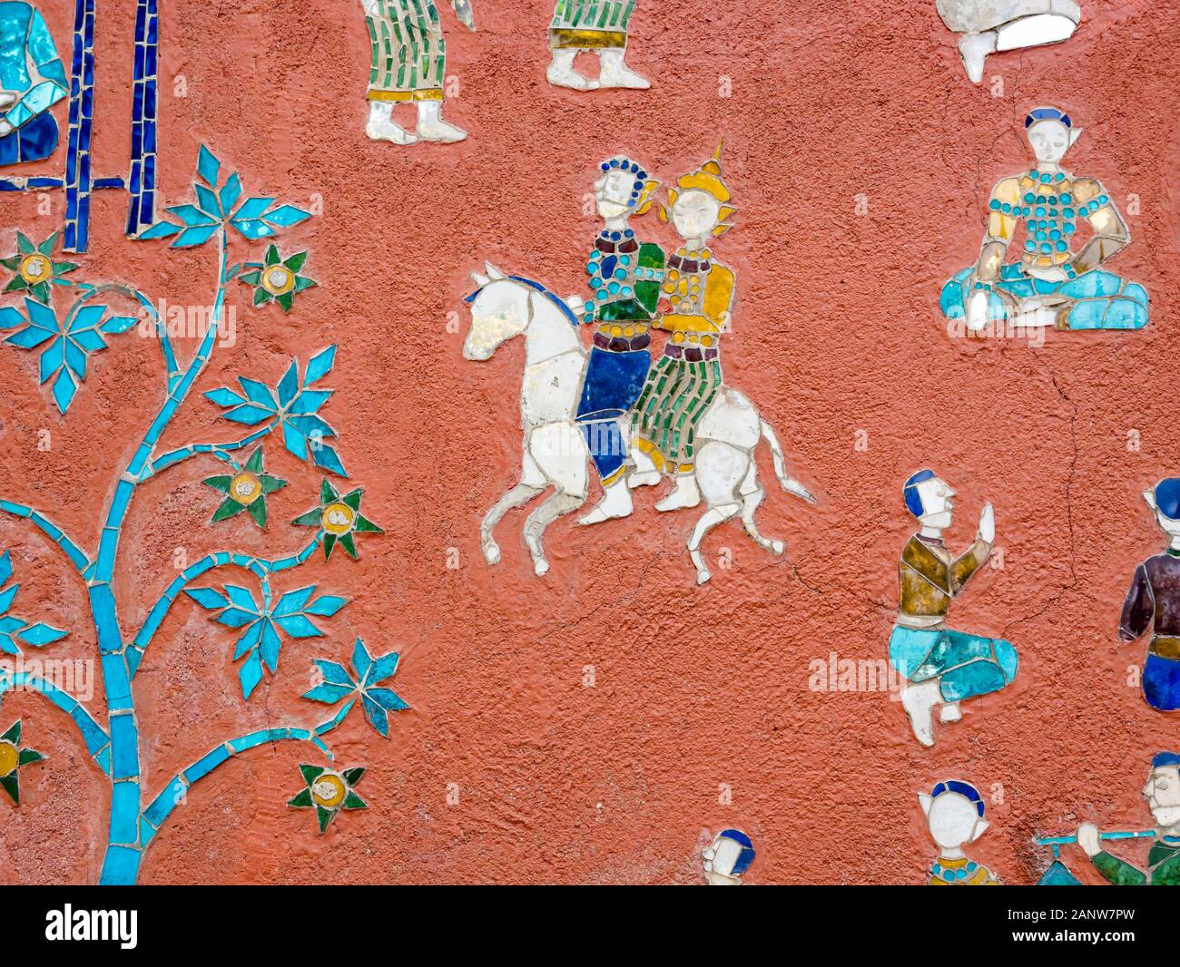 Colourful mosaic story depiction with couple on horseback, Wat Xien Thong temple, Luang Prabang, Laos, Southeast Asia Stock Photo
