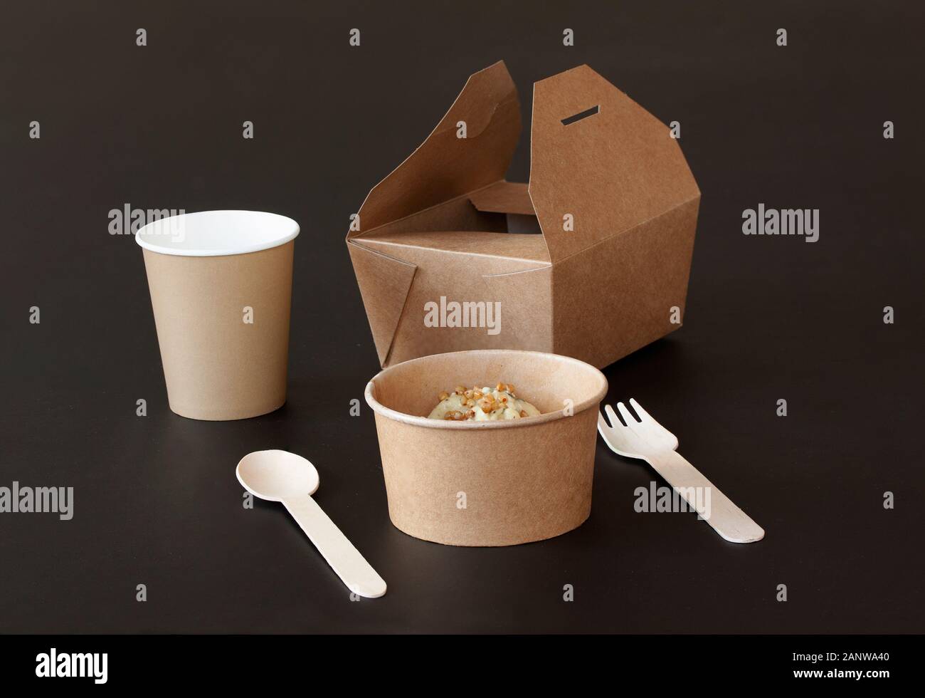 Sustainable Food Packaging. Eco-friendly bamboo sustainable and disposable tableware and take-out packaging on black background. Copenhagen, Denmark - Stock Photo