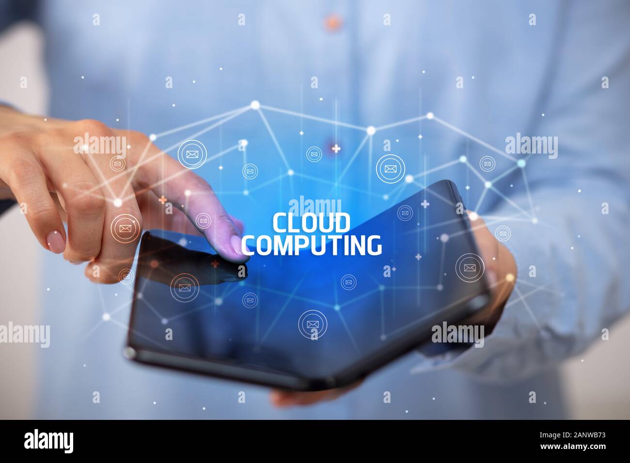 Businessman holding a foldable smartphone with CLOUD COMPUTING ...