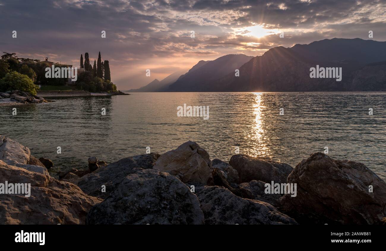 Sunset in Italy on the shores of Lake Garda Stock Photo - Alamy