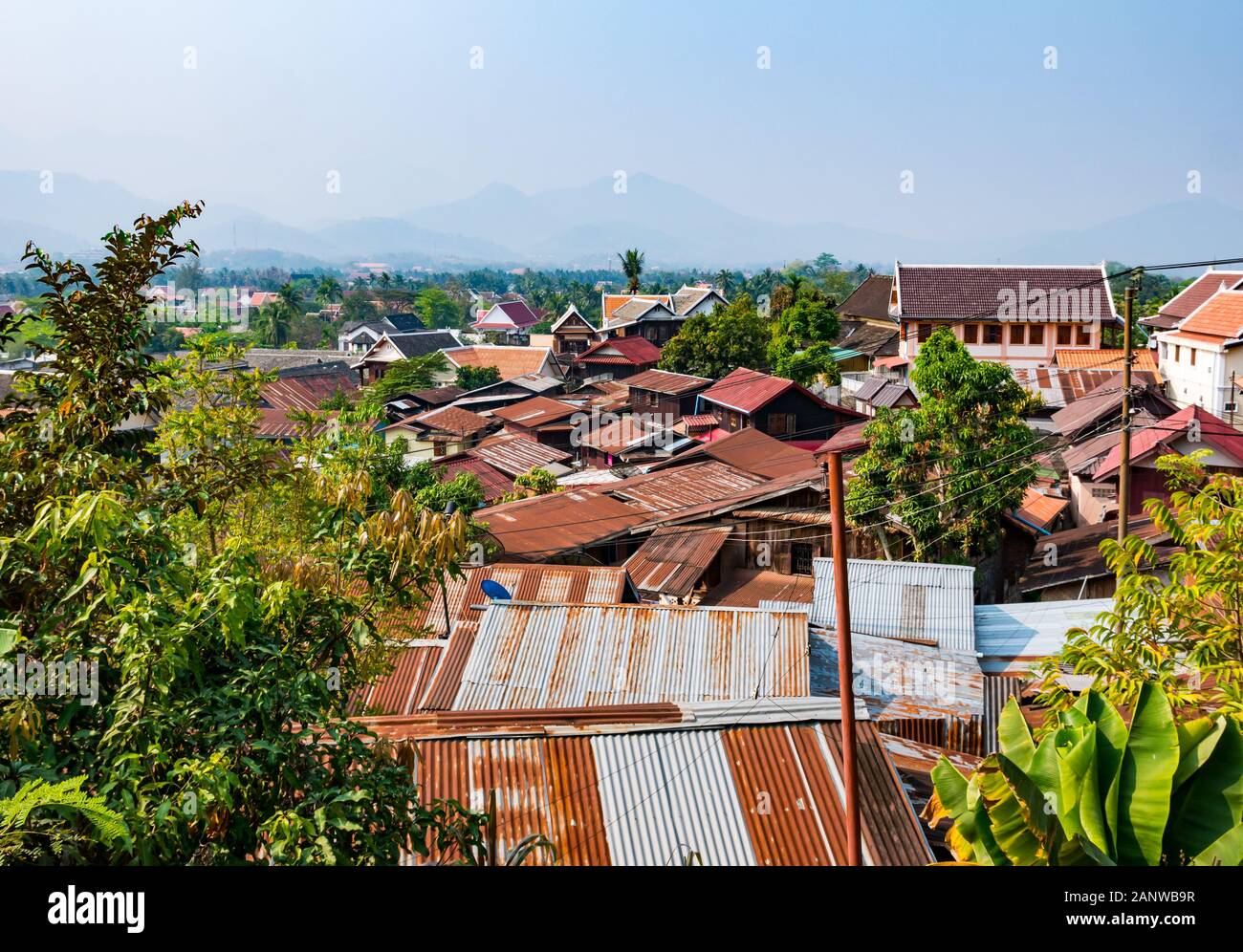 View over tin rooftops from Phousi Hill, Luang Prabang, Laos, Southeast Asia Stock Photo