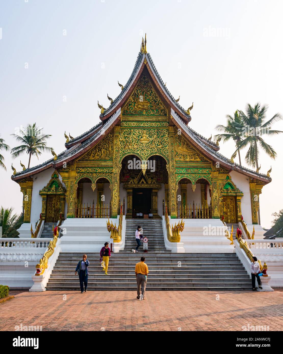 Tourists at Haw Pha Bang temple, Royal Palace, Luang Prabang, Laos, Southeast Asia Stock Photo