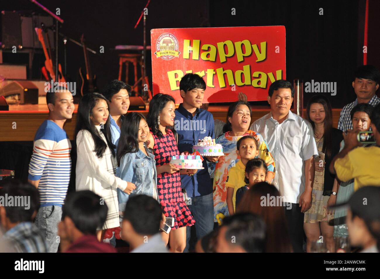 Cambodian Birthday Party w/ birthday cakes & sign, Spark & Tawandang German Brewery, Phnom Penh, Cambodia, Indochina. © Kraig Lieb Stock Photo