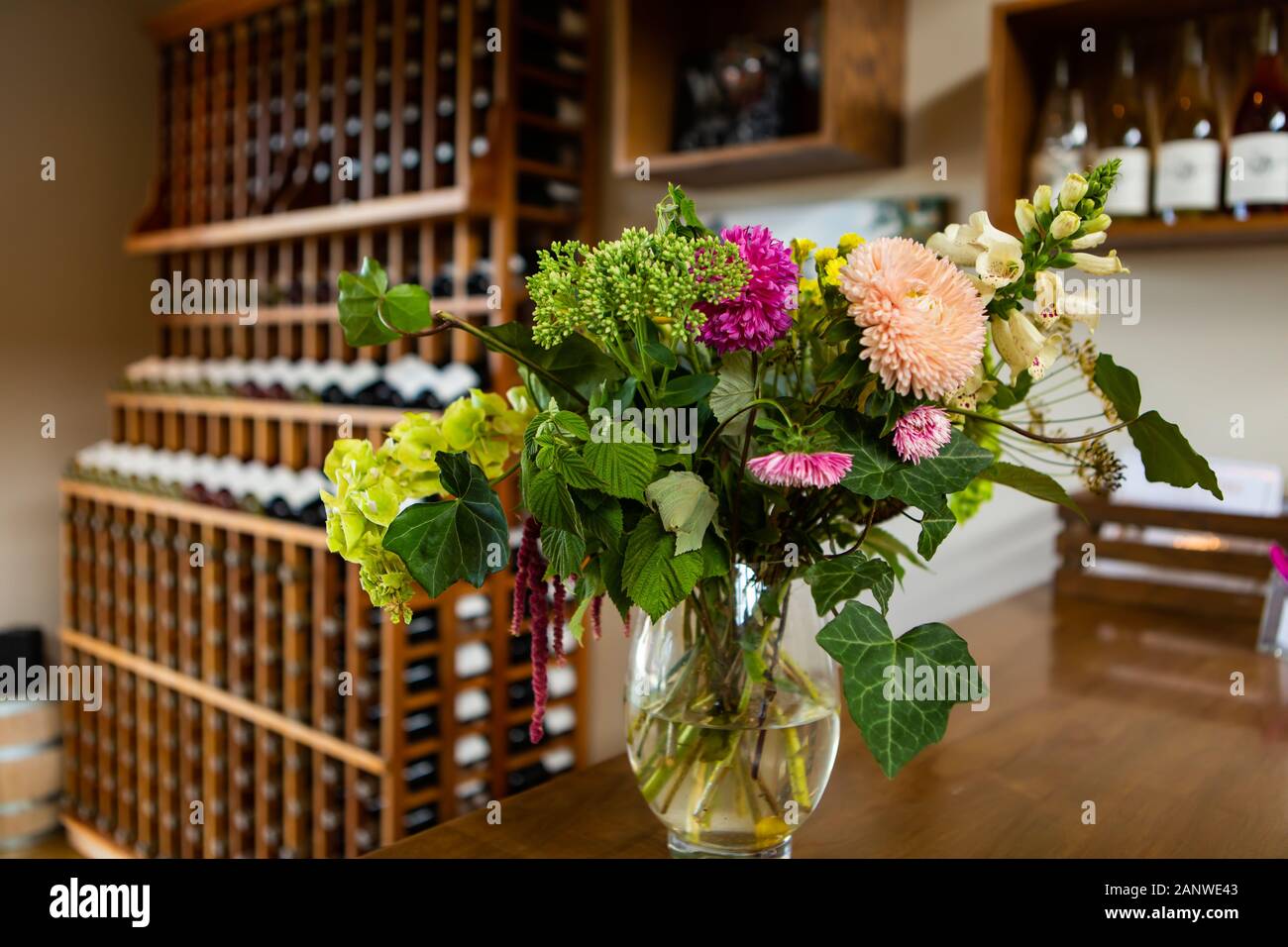 colorful natural flowers on vase selective focus view, winery tasting room wines shop, wine