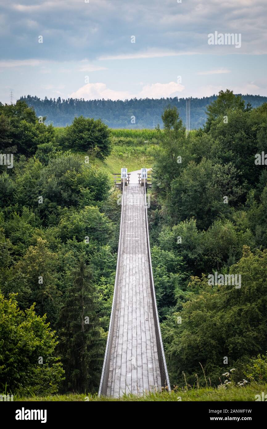 Suspension bridge St. Luzia on the bicycle track Drauradweg between Bleiburg and Neuhaus near the village Aich above the river Feistritz, Austria Stock Photo