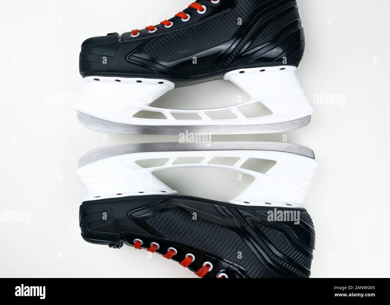 Hockey skates blades closeup isolated on grey background. Selective focus. Stock Photo