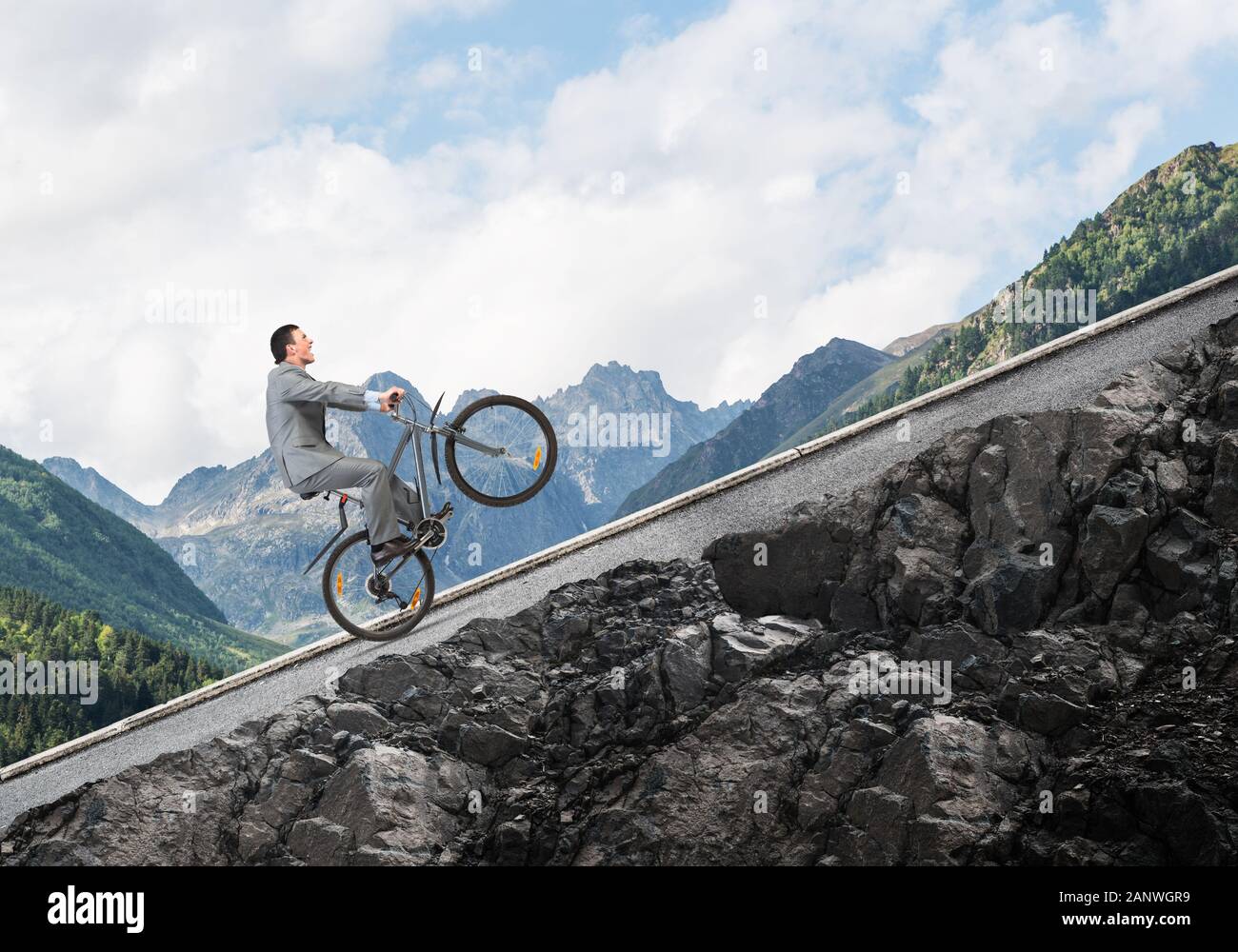 Person riding bike uphill hires stock photography and images Alamy