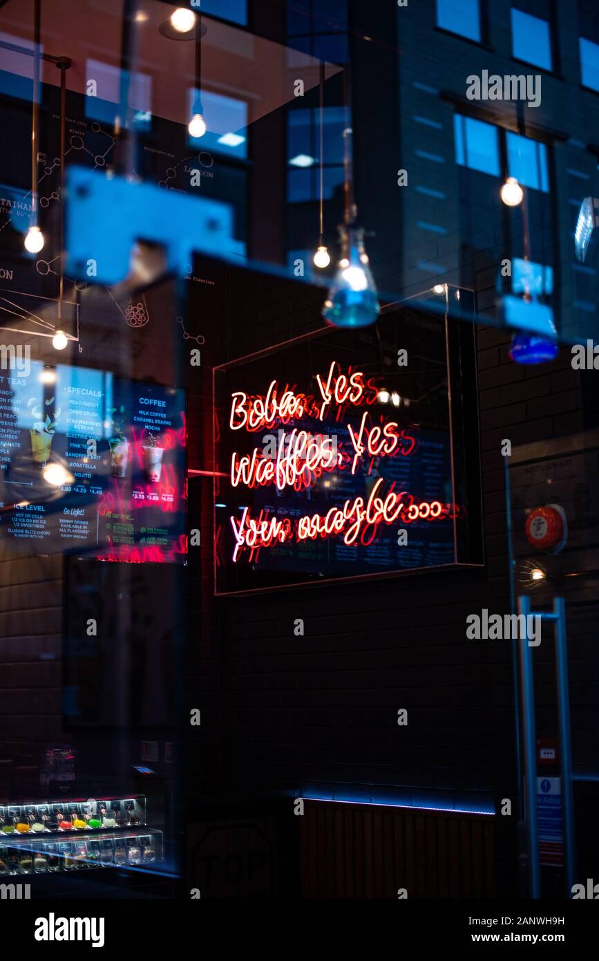 Close up of neon open sign on the exterior of a small business feature ...