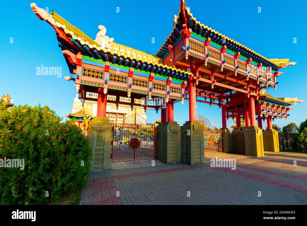 Gate to the Buddhist temple. Om mani padme hum or O, the jewel in the lotus, the mystic formula of the Tibetans and nothern Buddhists used as a charm. Stock Photo