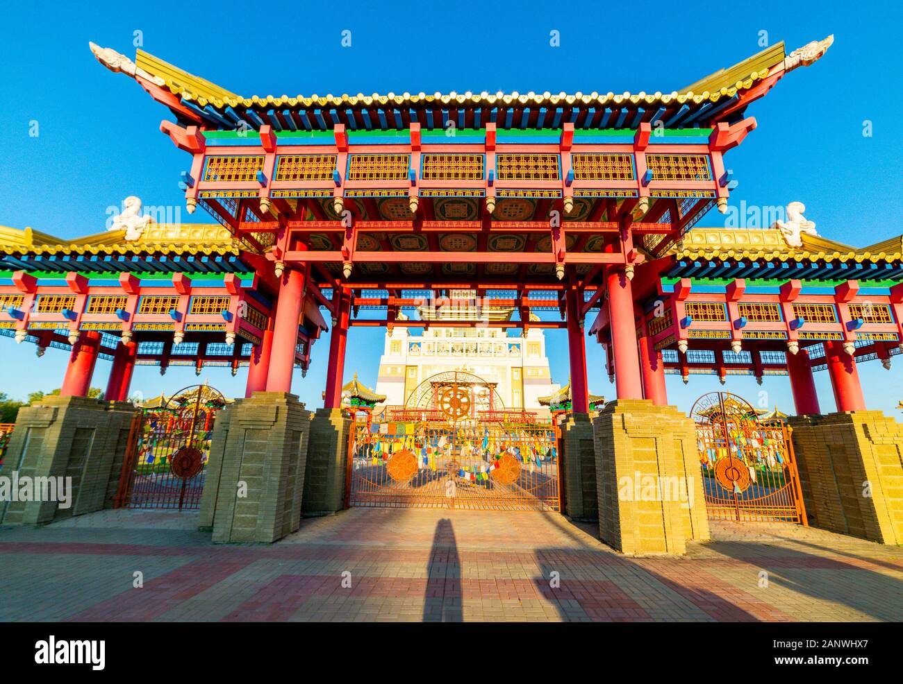 Gate to the Buddhist temple. Om mani padme hum or O, the jewel in the lotus, the mystic formula of the Tibetans and nothern Buddhists used as a charm. Stock Photo
