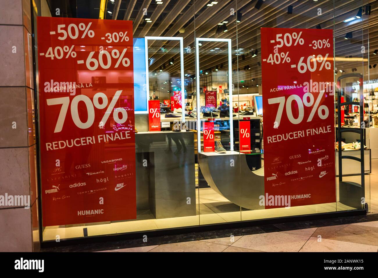 Discount, sale signs, red poster offer, mock up advertise display frame  over clothes in shopping mall or department store for show promotion  product a Stock Photo - Alamy