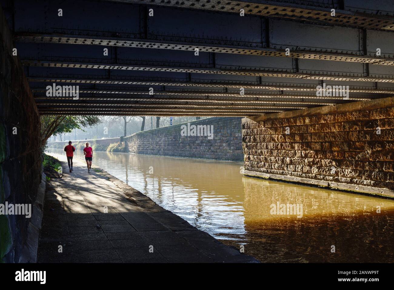 Nottingham Canal Side Winter's Morning People Jogging. Stock Photo