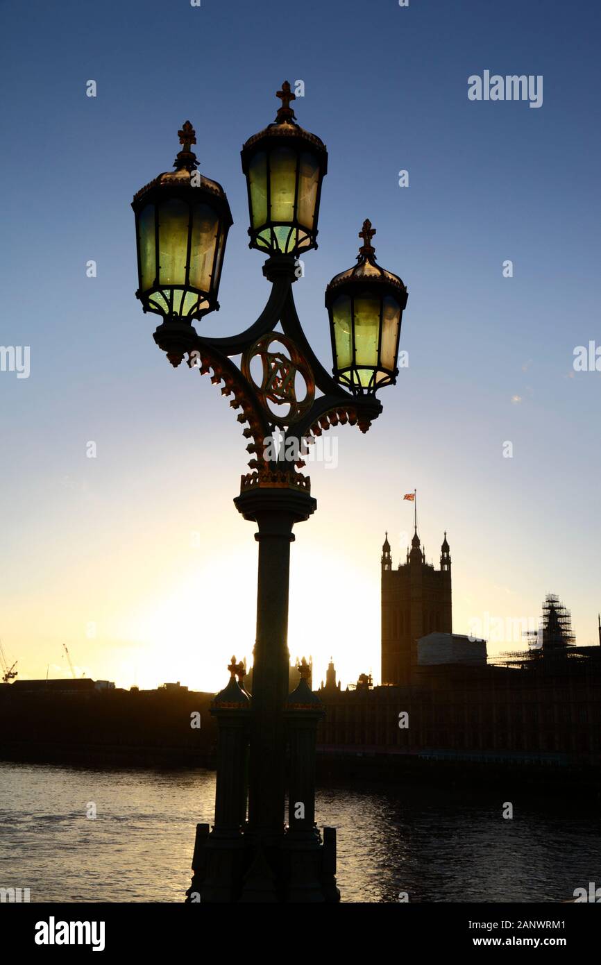 Ornate street lamp on Westminster Bridge, Victoria tower and Palace of Westminster / Houses of Parliamen in background, London, England Stock Photo