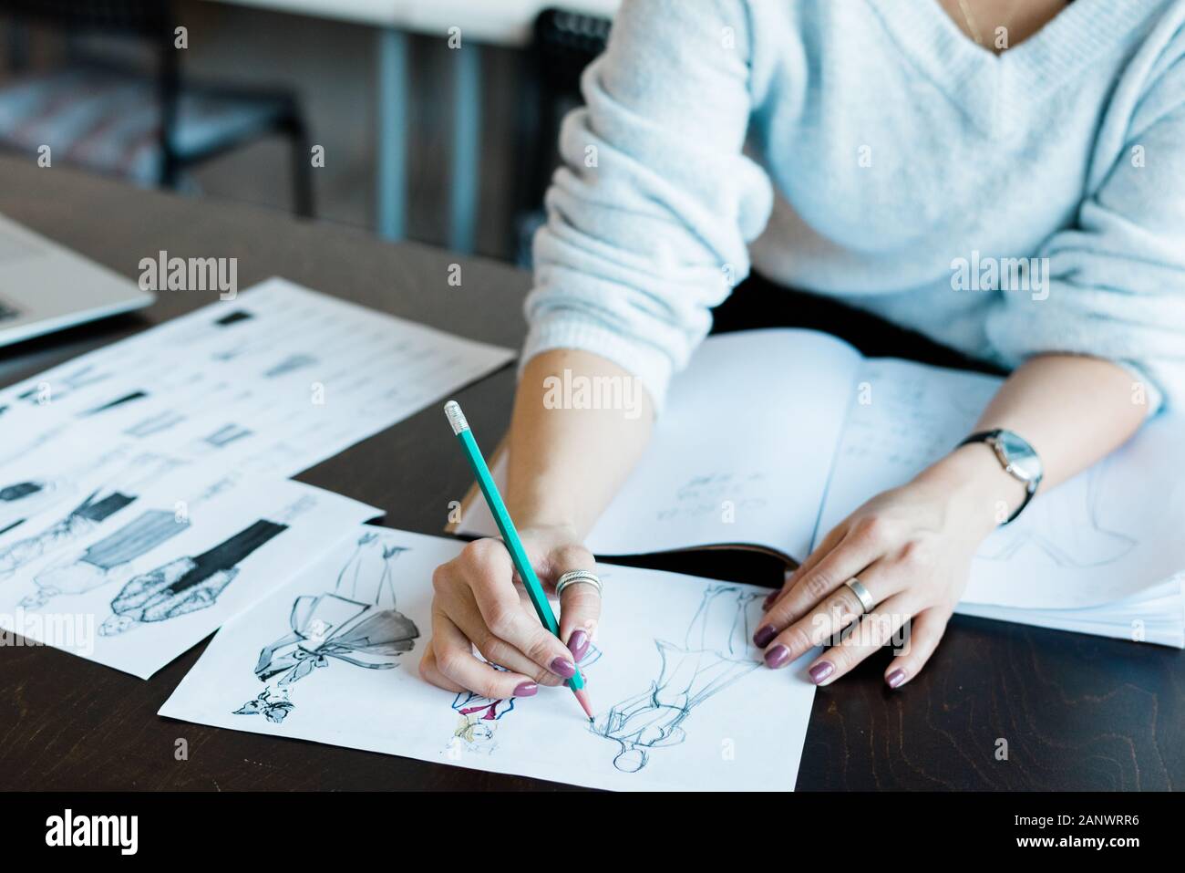 Woman working on fashion sketch design Stock Photo