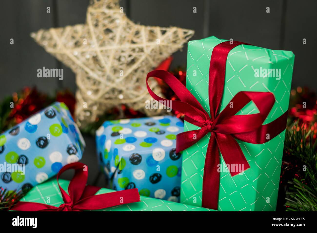 Christmas gifts decorated with red bows and wrapped in wrapping paper