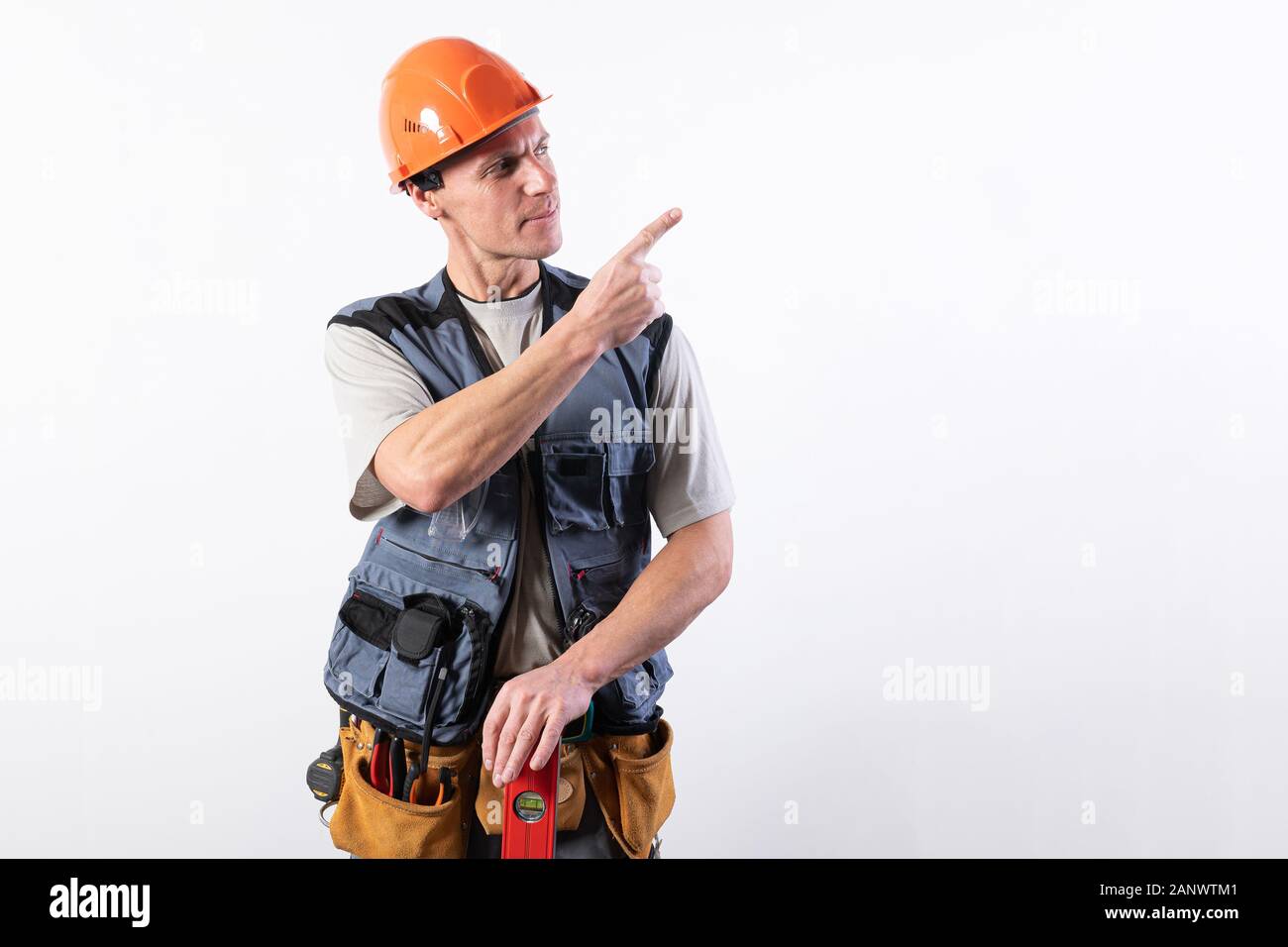 Handsome man in a white dress. Takes off the glove. Stock Photo
