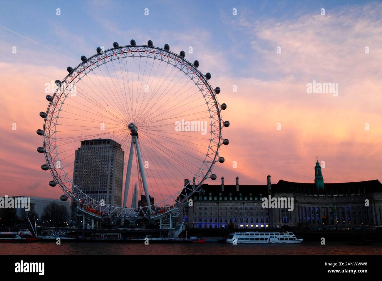 London Eye, Shell Centre building and County Hall at sunset, London, England Stock Photo