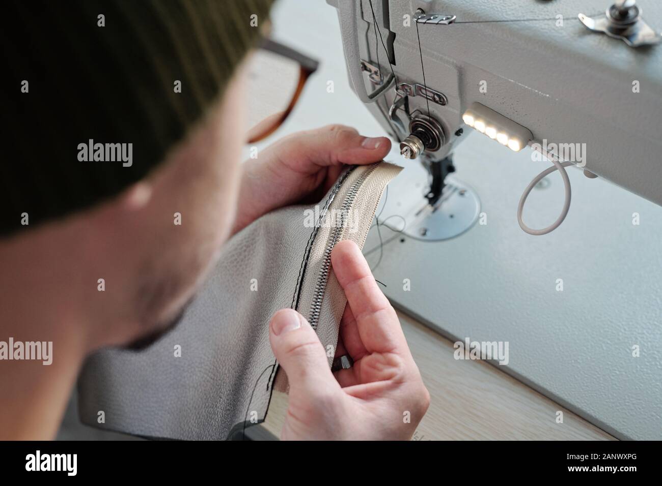 Stitching zipper on leather sewing machine Stock Photo Alamy
