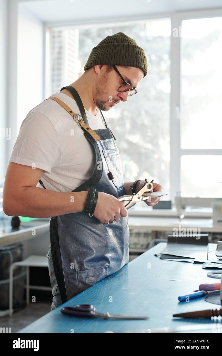 Using rotary punch Stock Photo
