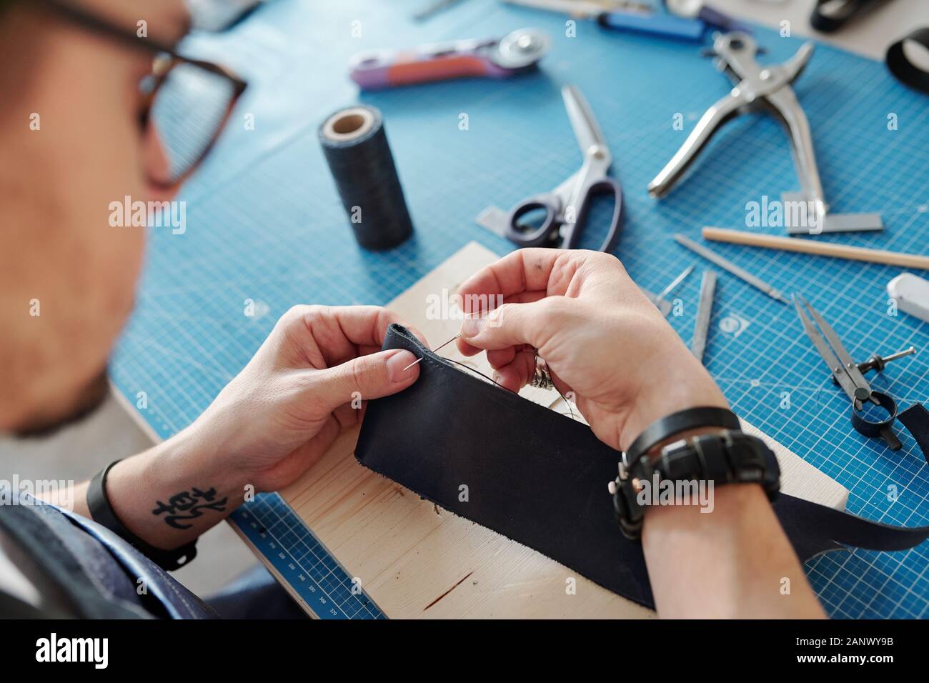 Sewing leather pieces together Stock Photo Alamy