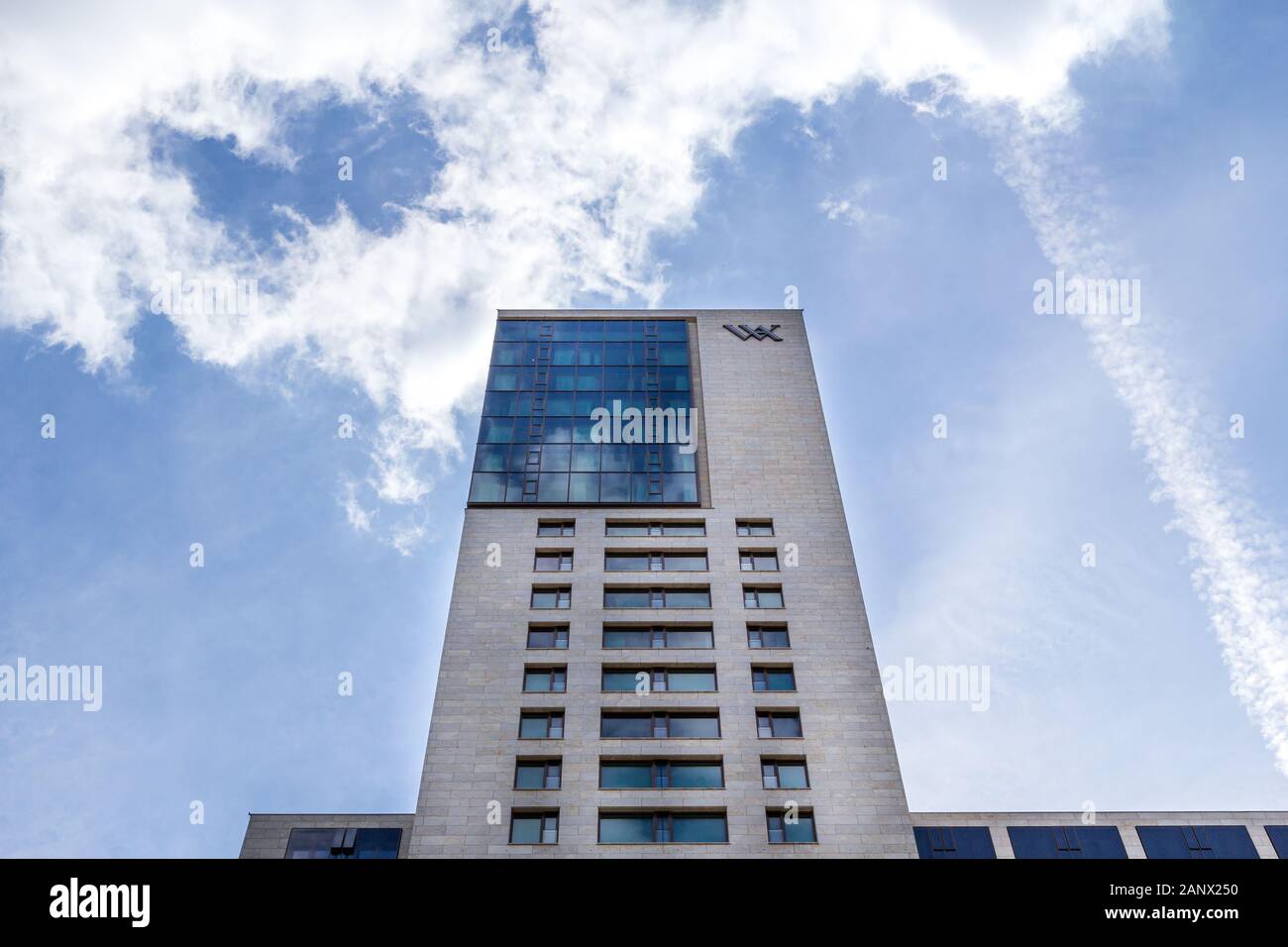 Berlin, Germany - May 30, 2019: The skyscraper Zoofenster is rising towards the blue sky. The emblem of Waldorf Astoria is mounted on the facade as it Stock Photo